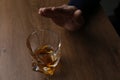 Man refusing to drink whiskey at wooden table, closeup. Alcohol addiction treatment Royalty Free Stock Photo