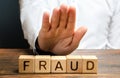 A man rejects the word Fraud with his hand. Countering deception, protection against fraudsters. The fight corruption, financial Royalty Free Stock Photo