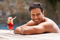 Man, relax and portrait at swimming pool with cocktail at hotel, resort and travel on luxury vacation. Summer, holiday Royalty Free Stock Photo