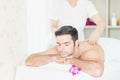 Man relax in skin care aroma therapy and scrub spa, in Thailand resort Royalty Free Stock Photo