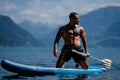 Man relaxed at the lake. Handsome man with nude torso on the summer beach. Portrait of an sexy man on a Alps lake