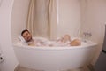 Man relaxing all tensions in the bathtub