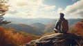 Man relaxing on autumn hiking trip. Man hiker standing on top of the mountain enjoying beautiful fall scenery. Smoky Mountains Royalty Free Stock Photo