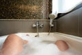 Man relaxing in bath with tropical Organic skin health care