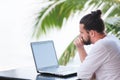 Man relaxing on the beach with laptop, freelancer workplace, dream job Royalty Free Stock Photo