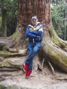 A man relaxing with a beautiful Japan , Nikko autumn tree