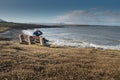 Man relaxing on a bench with a beautiful view on Atlantic ocean