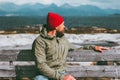 Man relaxing on bench enjoying sea and mountains landscape Norway vacations Traveling Lifestyle concept. Traveler sitting alone we Royalty Free Stock Photo