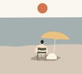 Man relaxing on chair at sandy beach under yellow umbrella. Royalty Free Stock Photo