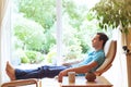Man relaxing in deck chair at home, relaxation Royalty Free Stock Photo
