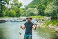 Man relaxing and fishing by lakeside. Fun and relax. Fishing freshwater lake pond river. Just do that only. Fisherman in Royalty Free Stock Photo