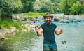 Man relaxing and fishing by lakeside. Fun and relax. Fishing freshwater lake pond river. Just do that only. Fisherman in Royalty Free Stock Photo