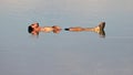 Man floating on Dead sea, Israel