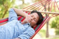 Man Relaxing In Hammock Royalty Free Stock Photo