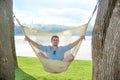 Man relaxing in hammock