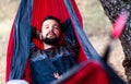 Man relaxing in a hammock on a picnic Royalty Free Stock Photo