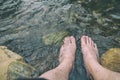 Man Relaxing His Feet in the Cold and Fresh Waterfall Royalty Free Stock Photo