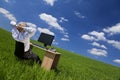 Man Relaxing At Office Desk In a Green Field Royalty Free Stock Photo