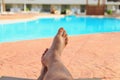 Man relaxing by the pool