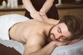 Man relaxing during a salt scrub beauty therapy Royalty Free Stock Photo