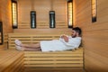 Man relaxing in sauna and staying healthy