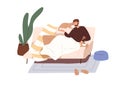 Man relaxing on sofa with cat. Person resting on couch with kitty at home. Happy guy sitting under warm blanket at cozy