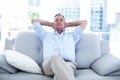 Man relaxing on sofa at home Royalty Free Stock Photo