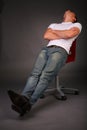 Man relaxing on stool Royalty Free Stock Photo