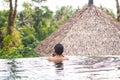 Man relaxing in swimming pool. Royalty Free Stock Photo