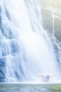 A man relaxing under fresh waterfall Royalty Free Stock Photo