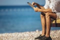 Man relaxing and use digital tablet at sea beach Royalty Free Stock Photo
