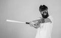 Man reliving stress in virtual reality game, emotion control concept. Angry bearded man using baseball bat for fighting