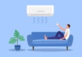 Man remote control air conditioner in living room. Royalty Free Stock Photo