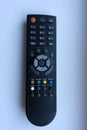 The man with the remote control in hand watching the sports channel and presses the button on the remote control. Remote control i Royalty Free Stock Photo