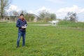 A man with a remote control in his hands. Flight control of the drone. Phantom Royalty Free Stock Photo