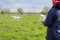 A man with a remote control in his hands. Flight control of the drone. Phantom