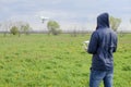 A man with a remote control in his hands. Flight control of the drone. Phantom