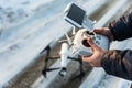 Man with remote control prepare white drone digital camera for start flying Royalty Free Stock Photo