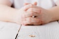 Man removes a gold wedding ring from his finger. Concept of family quarrel, divorce or betrayal