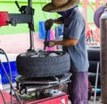 The man removing car tire Royalty Free Stock Photo