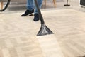 Man removing dirt from carpet with vacuum cleaner Royalty Free Stock Photo