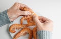man removing the head of a cooked prawn Royalty Free Stock Photo