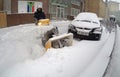 Man Removing Snow with a Snowblower