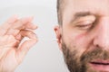 Man removing wax from ear using Q-tip Royalty Free Stock Photo