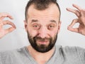 Man removing wax from ear using Q-tip Royalty Free Stock Photo