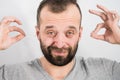 Man removing wax from ear using Q-tip Royalty Free Stock Photo