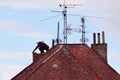 Man renovating an old chimney on the rooftop Royalty Free Stock Photo