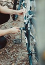 Man repair of a bicycle in the forest Royalty Free Stock Photo