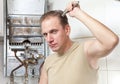 The man repair of a gas water heater Royalty Free Stock Photo