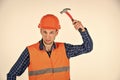 Man repair master knoking own head claw hammer, feeling protected concept